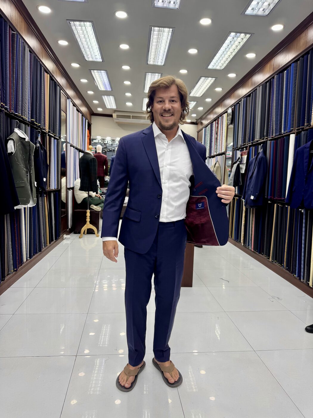 Jesse trying on a tailored suit