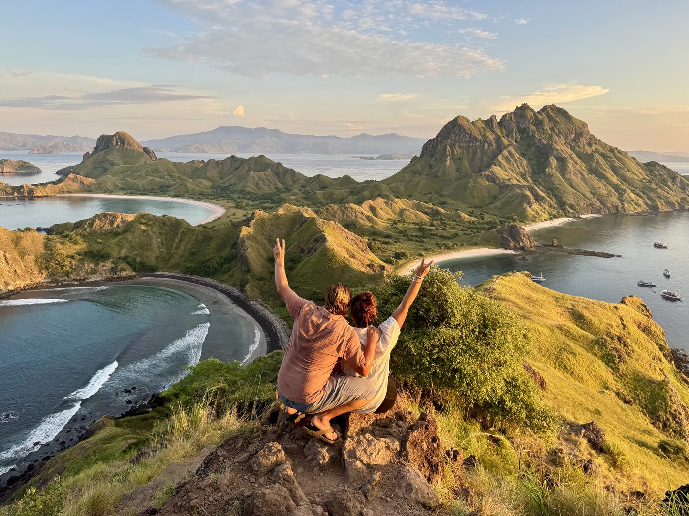 Jesse and Karlee on a ridge above the bays of Padar Island in Indonesia