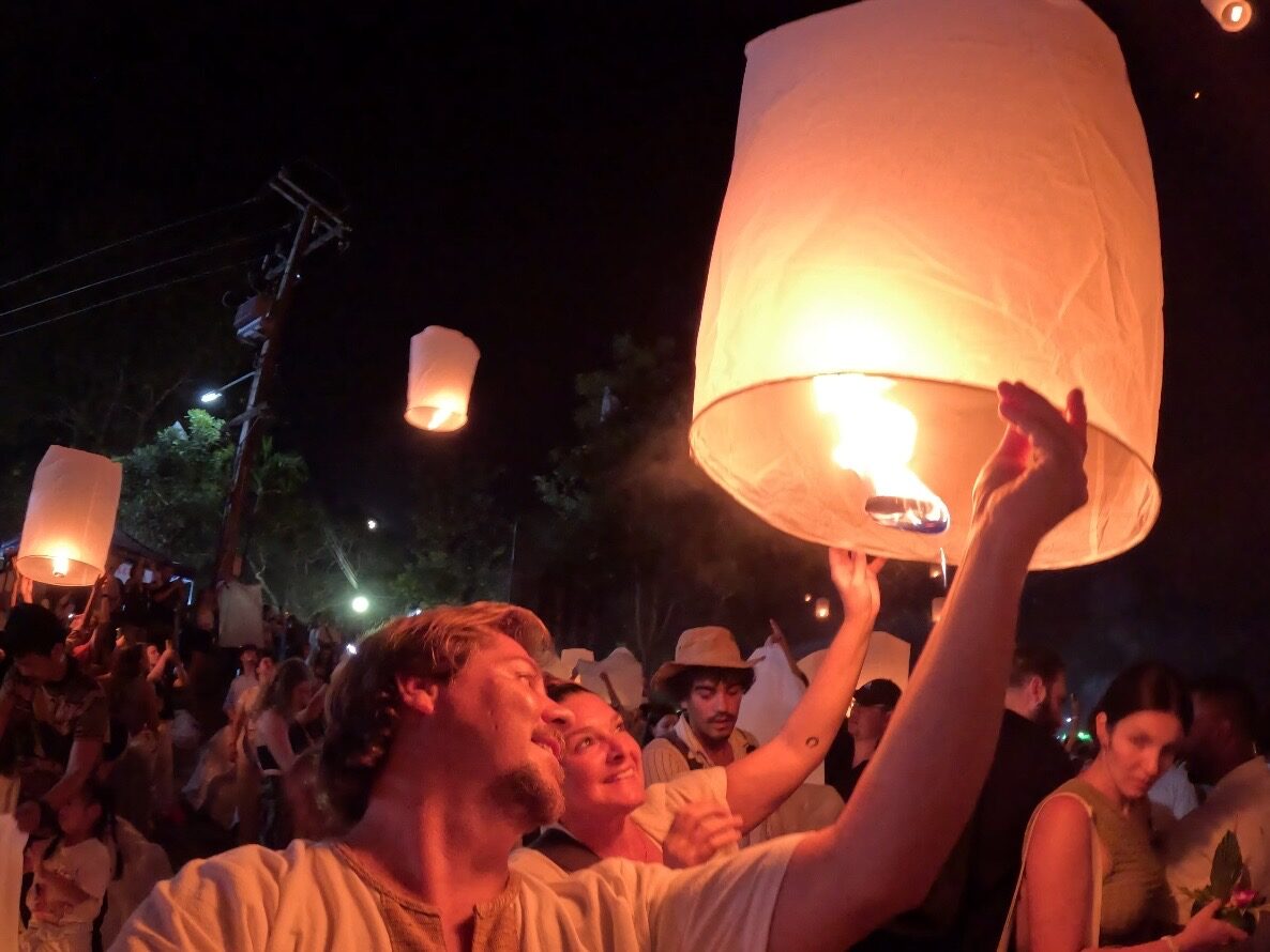 Jesse and Karlee releasing paper lanterns at Yi Peng in Chiang Mai
