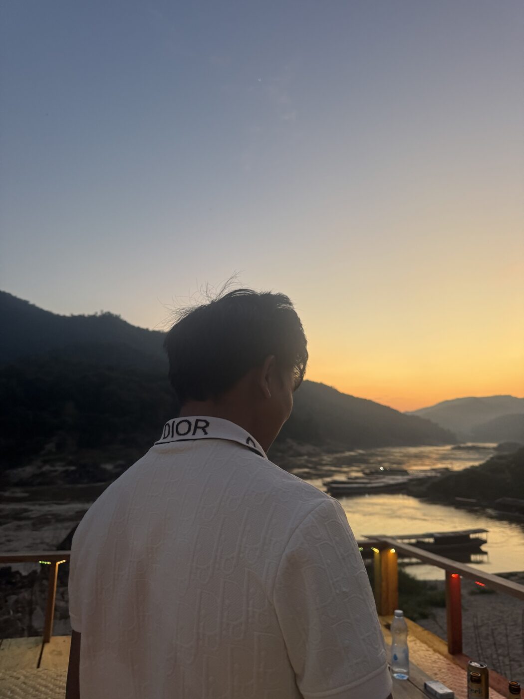 Jesse watching the sun go down over the Mekong