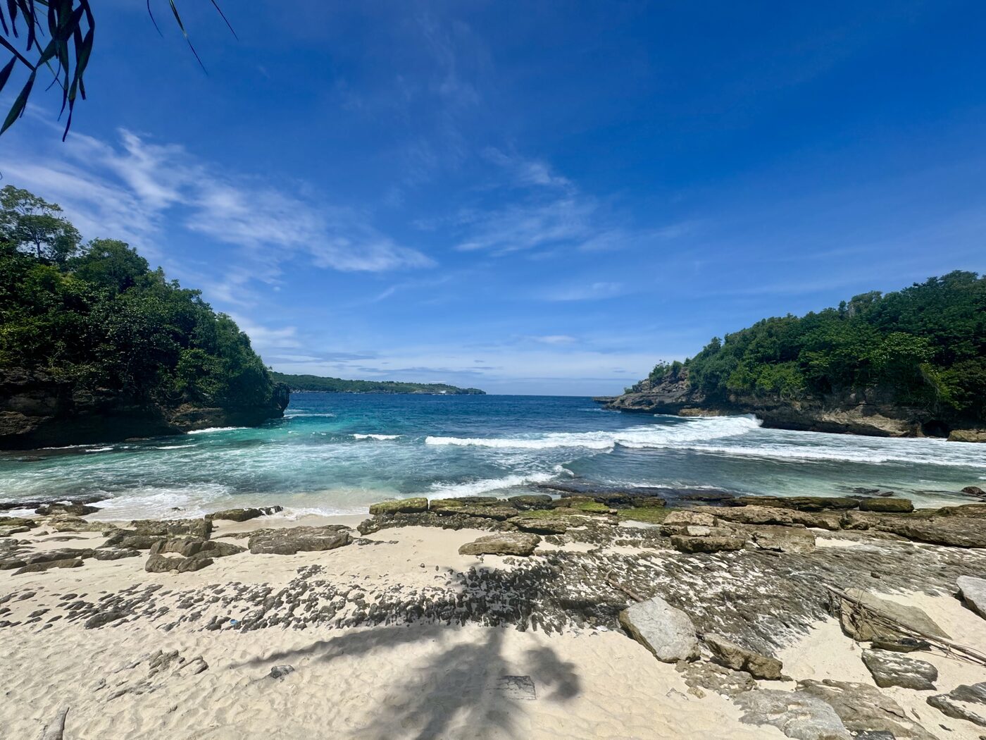Turquoise water and limestone coastline on Nusa Lembongan