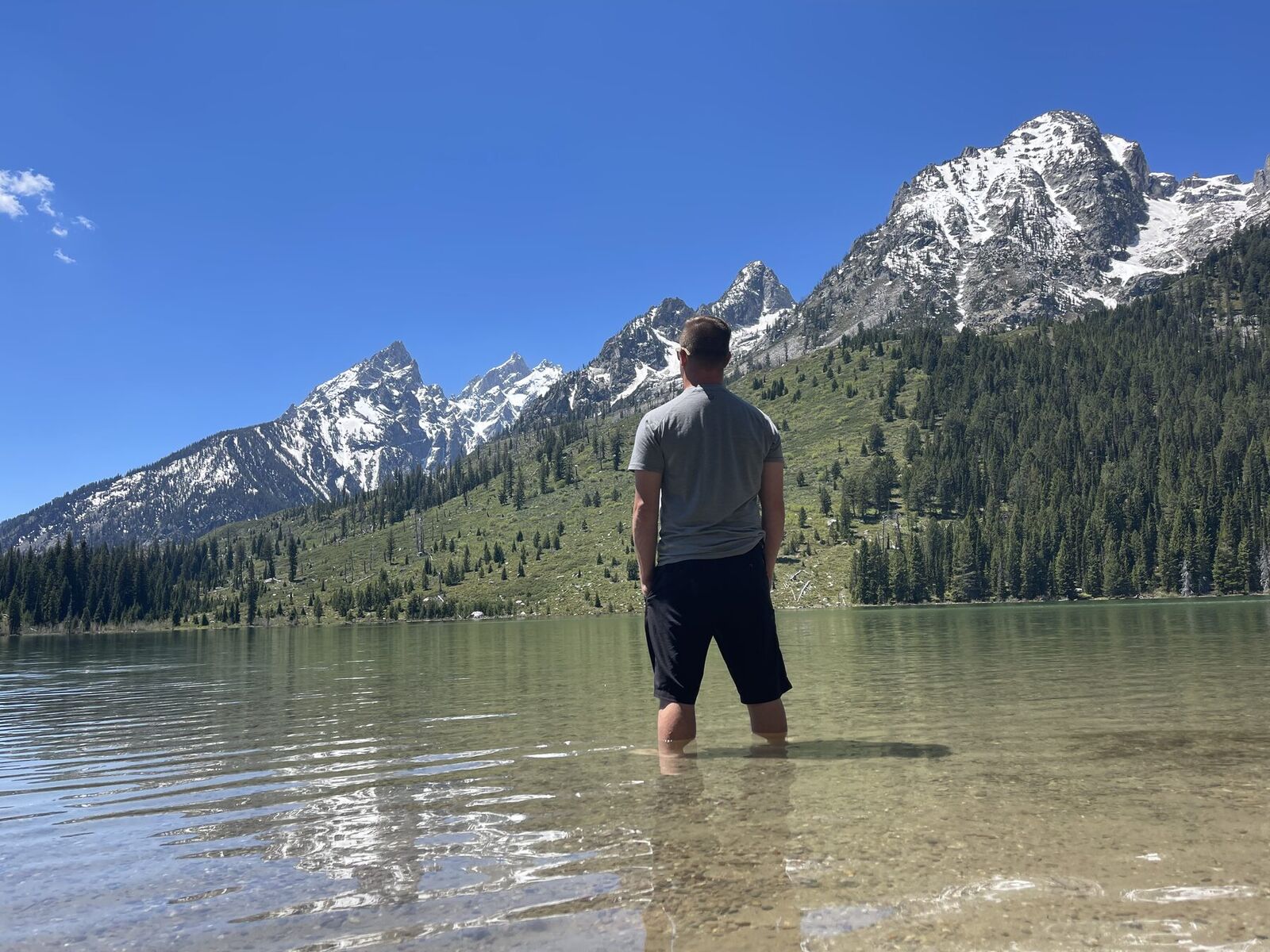 A still alpine lake below the Teton range